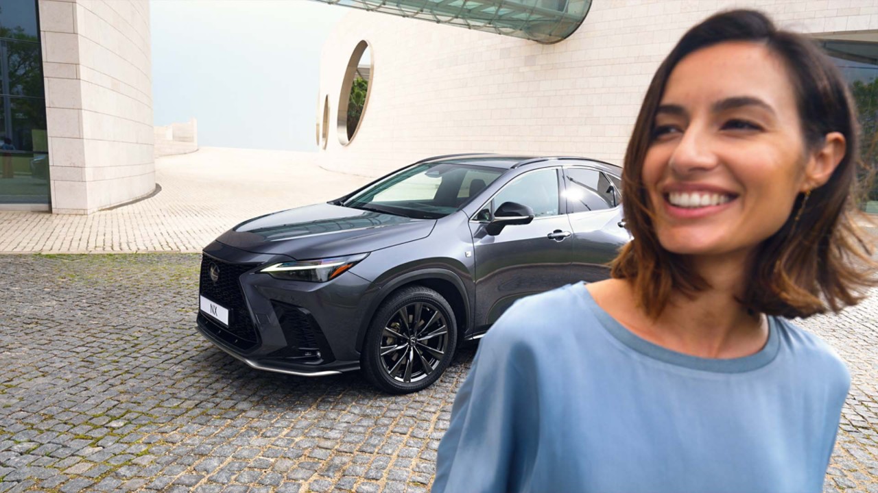 A Lexus NX driving on a hillside road